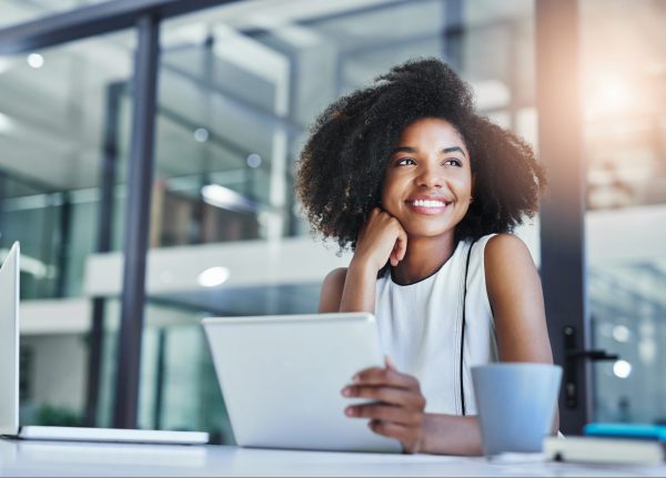 attractive young businesswoman working in her office